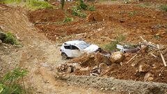 A view shows a damaged car amid debris in the aftermath of a landslide caused by heavy rains in Choco, Colombia January 13, 2024. Jean Arriaga/Choco Goverment/Handout via REUTERS THIS IMAGE HAS BEEN SUPPLIED BY A THIRD PARTY. NO RESALES NO ARCHIVES. MANDATORY CREDIT.