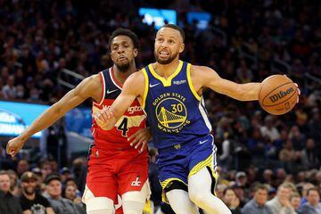 SAN FRANCISCO, CALIFORNIA - MARCH 14: Stephen Curry #30 of the Golden State Warriors dribbles past Ish Smith #4 of the Washington Wizards at Chase Center