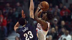 CHICAGO, IL - JANUARY 14: Jimmy Butler #21 of the Chicago Bulls is fouled while shooting by Anthony Davis #23 of the New Orleans Pelicans at the United Center on January 14, 2017 in Chicago, Illinois. NOTE TO USER: User expressly acknowledges and agrees t