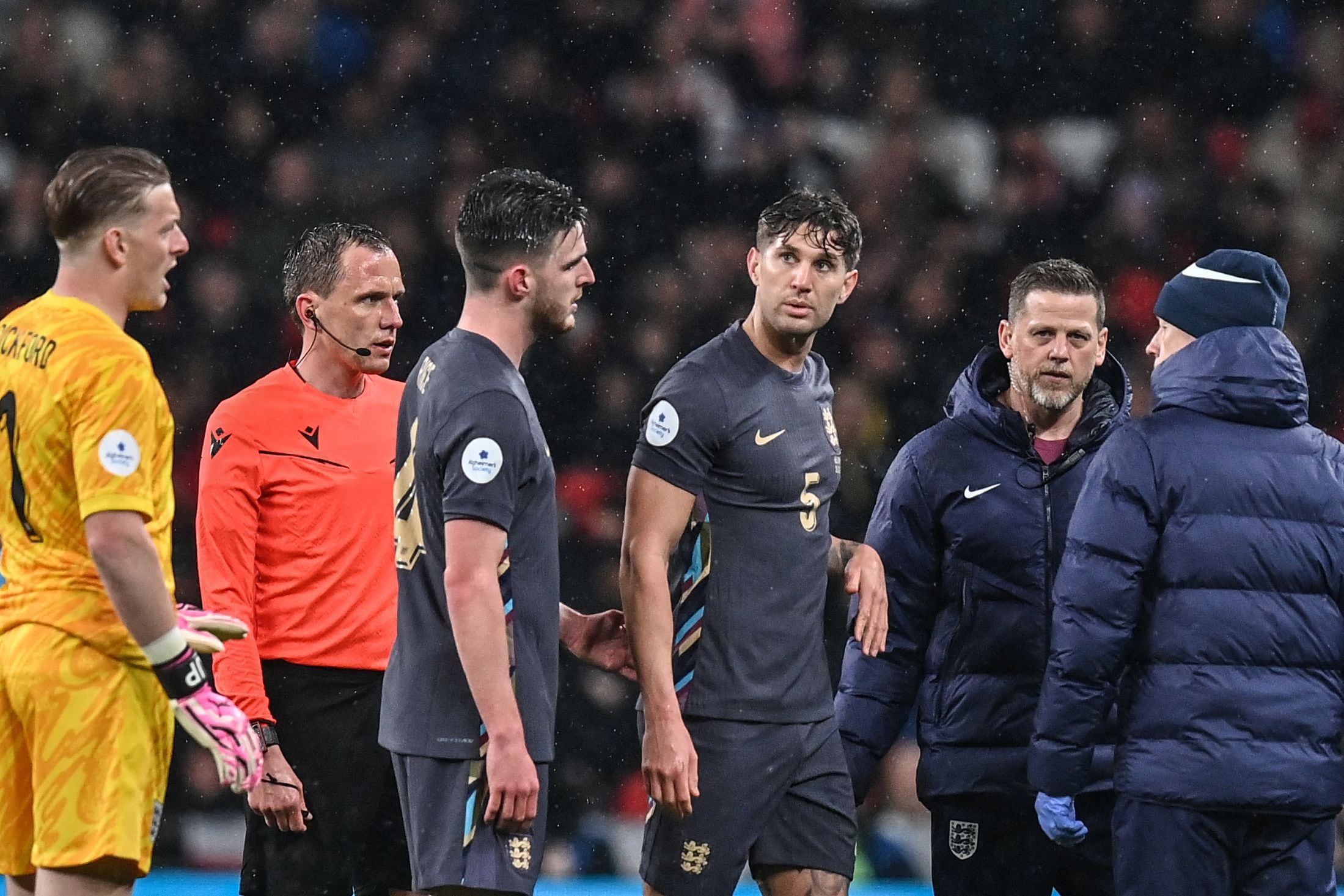 England's defender #05 John Stones leaves the pitch after being injured during the International friendly football match between England and Belgium at Wembley stadium, in London, on March 26, 2024. (Photo by Glyn KIRK / AFP) / NOT FOR MARKETING OR ADVERTISING USE / RESTRICTED TO EDITORIAL USE