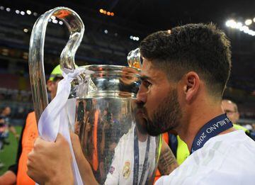 Isco kisses the trophy after winning the Champions League but he'll not be chasing the Euro 2016 trophy with his countrymen this summer.