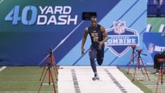 Wide receiver John Ross of Washington runs the 40-yard dash in an unofficial record time of 4.22 seconds during day four of the NFL Combine at Lucas Oil Stadium.