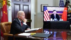 (FILES) In this file photo taken on November 15, 2021 US President Joe Biden meets with China&#039;s President Xi Jinping during a virtual summit from the Roosevelt Room of the White House in Washington, DC. - US President Joe Biden will warn his Chinese 