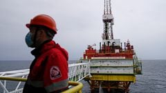 FILE PHOTO: An employee is seen at an oil platform operated by Lukoil company at the Kravtsovskoye oilfield in the Baltic Sea, Russia September 16, 2021. REUTERS/Vitaly Nevar/File Photo