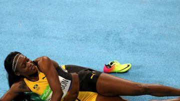 RIO DE JANEIRO, BRAZIL - AUGUST 17: Elaine Thompson of Jamaica reacts after winning the gold medal in the Women&#039;s 200m Final on Day 12 of the Rio 2016 Olympic Games at the Olympic Stadium on August 17, 2016 in Rio de Janeiro, Brazil. (Photo by Ian Wa