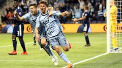 KANSAS CITY, KANSAS - APRIL 27: Krisztian Nemeth #9 of Sporting Kansas City celebrates with Kelyn Rowe #11 after scoring during the second half of the game against the New England Revolution at Children&#039;s Mercy Park on April 27, 2019 in Kansas City, Kansas.   Jamie Squire/Getty Images/AFP == FOR NEWSPAPERS, INTERNET, TELCOS &amp; TELEVISION USE ONLY ==