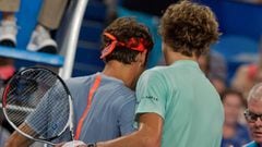 Alexander Zverev of Germany (R) is congratulated by Roger Federer of Switzerland after Zverev&#039;s win during their eighth session men&#039;s singles match on day four of the Hopman Cup tennis tournament in Perth on January 4, 2017.   / AFP PHOTO / TONY