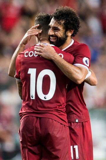 Salah celebrates with teammate Philippe Coutinho