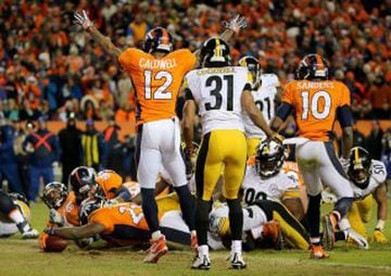 DENVER, CO - JANUARY 17: C.J. Anderson #22 of the Denver Broncos scores a touchdown in the fourth quarter against the Pittsburgh Steelers during the AFC Divisional Playoff Game at Sports Authority Field at Mile High on January 17, 2016 in Denver, Colorado