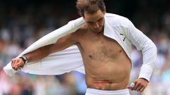 LONDON, ENGLAND - JULY 06: Rafael Nadal  v Taylor Fritz - Rafael Nadal removes his shirt revealing the tape for his abdominal injury after his five set victory during day ten of The Championships Wimbledon 2022 at All England Lawn Tennis and Croquet Club on July 6, 2022 in London, England. (Photo by Simon Stacpoole/Offside/Offside via Getty Images)
