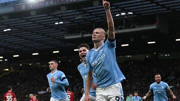 Manchester City's Norwegian striker #09 Erling Haaland celebrates after scoring the opening goal from the penalty spot during the English Premier League football match between Manchester United and Manchester City at Old Trafford in Manchester, north west England, on October 29, 2023. (Photo by Paul ELLIS / AFP) / RESTRICTED TO EDITORIAL USE. No use with unauthorized audio, video, data, fixture lists, club/league logos or 'live' services. Online in-match use limited to 120 images. An additional 40 images may be used in extra time. No video emulation. Social media in-match use limited to 120 images. An additional 40 images may be used in extra time. No use in betting publications, games or single club/league/player publications. / 