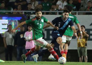 Guatemala's Gilberto Sepulveda(R) and Mexico's Nestor Araujo vie for the ball vie for the ball during the international friendly football match between Mexico and Guatemala 