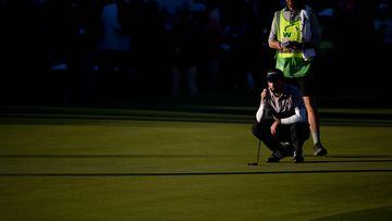 SCOTTSDALE, ARIZONA - FEBRUARY 11: Nick Taylor of Canada and caddie Dave Markle line up a putt on the 18th green during the final round of the WM Phoenix Open at TPC Scottsdale on February 11, 2024 in Scottsdale, Arizona.