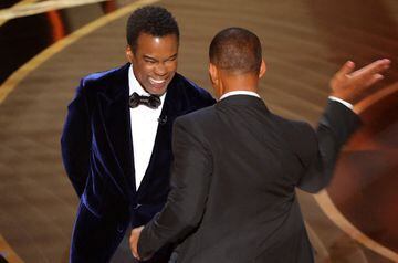 Will Smith hits Chris Rock as Rock spoke on stage during the 94th Academy Awards