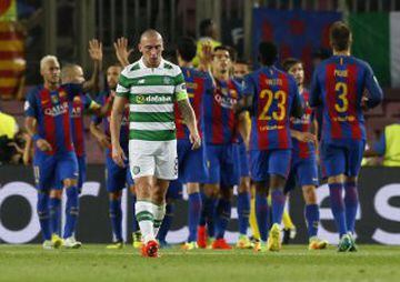 Football Soccer - FC Barcelona v Celtic - UEFA Champions League Group Stage - Group C - The Nou Camp, Barcelona, Spain - 13/9/16
Celtic's Scott Brown looks dejected as Barcelona's Lionel Messi celebrates scoring their fifth goal 
Reuters / Albert Gea
Live