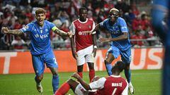 Napoli's players celebrate after Sporting Braga's Malian defender #04 Sikou Niakate (DOWN) scored an own-goal during the UEFA Champions League 1st round day 1 group C football match between SC Braga and Napoli at the Municipal stadium of Braga on September 20, 2023. (Photo by MIGUEL RIOPA / AFP)