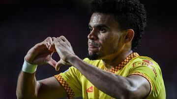 Liverpool&#039;s Colombian midfielder Luis Diaz celebrates after scoring his team&#039;s third goal during the UEFA Champions League quarter final first leg football match between SL Benfica and Liverpool FC at the Luz stadium in Lisbon on April 5, 2022. 