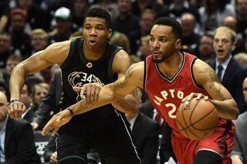 Norman Powell of the Toronto Raptors drives to the basket against Giannis Antetokounmpo of the Milwaukee Bucks