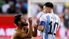 Argentina's Lionel Messi reacts as a fan ran on the pitch to ask for his autograh during the international friendly football match between Argentina and Jamaica at Red Bull Arena in Harrison, New Jersey, on September 27, 2022. (Photo by Andres Kudacki / AFP)