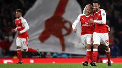 LONDON, ENGLAND - DECEMBER 10:  Alexis Sanchez of Arsenal (L) and Francis Coquelin of Arsenal (R) celebrate after Theo Walcott of Arsenal (not pictured) scored Arsenals first goal during the Premier League match between Arsenal and Stoke City at the Emira