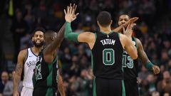 Dec 31, 2017; Boston, MA, USA; Boston Celtics forward Jayson Tatum (0) gets high fives from guard Terry Rozier (12) and forward Marcus Morris (13) during the second half against the Brooklyn Nets at TD Garden. Mandatory Credit: Bob DeChiara-USA TODAY Sports
