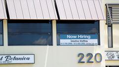 A staffing agency displays a &quot;Now Hiring&quot; sign in Tampa, Florida, U.S., June 1, 2021. 