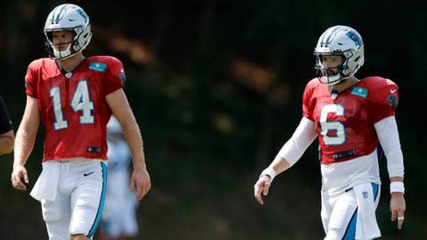 SPARTANBURG, SOUTH CAROLINA - AUGUST 02: Sam Darnold #14 and Baker Mayfield #6 of the Carolina Panthers walk the field during training camp at Wofford College on August 02, 2022 in Spartanburg, South Carolina. (Photo by Jared C. Tilton/Getty Images)