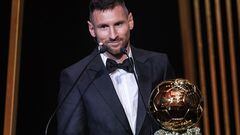TOPSHOT - Inter Miami CF's Argentine forward Lionel Messi reacts on stage next to his trophy as he receives his 8th Ballon d'Or award during the 2023 Ballon d'Or France Football award ceremony at the Theatre du Chatelet in Paris on October 30, 2023. (Photo by FRANCK FIFE / AFP)