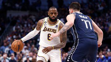 DALLAS, TX - FEBRUARY 26 : LeBron James #6 of the Los Angeles Lakers handles the ball as Luka Doncic #77 of the Dallas Mavericks defends in the second half at American Airlines Center on February 26, 2023 in Dallas, Texas. The Lakers won 111-108. NOTE TO USER: User expressly acknowledges and agrees that, by downloading and or using this photograph, User is consenting to the terms and conditions of the Getty Images License Agreement.   Ron Jenkins/Getty Images/AFP (Photo by Ron Jenkins / GETTY IMAGES NORTH AMERICA / Getty Images via AFP)