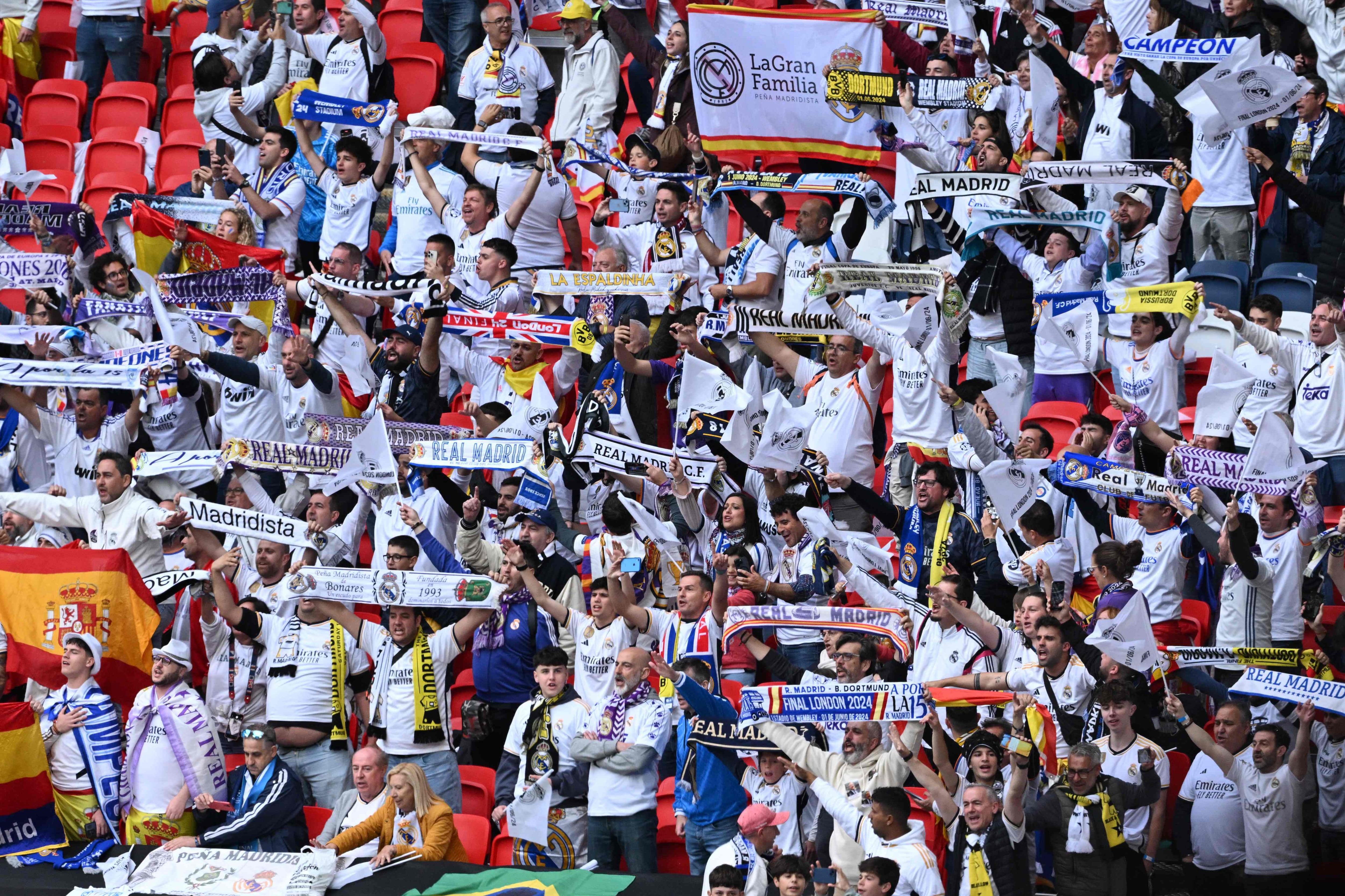 Real Madrid fans display their scarves prior to the UEFA Champions League final football match between Borussia Dortmund and Real Madrid, at Wembley stadium, in London, on June 1, 2024. (Photo by JUSTIN TALLIS / AFP)