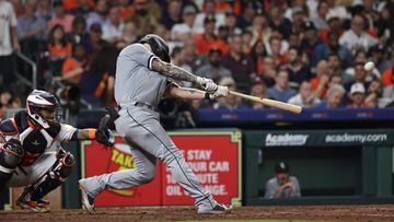 HOUSTON, TEXAS - MARCH 30: Yasmani Grandal #24 of the Chicago White Sox hits a home run in the eighth inning against the Houston Astros on Opening Day at Minute Maid Park on March 30, 2023 in Houston, Texas.   Bob Levey/Getty Images/AFP (Photo by Bob Levey / GETTY IMAGES NORTH AMERICA / Getty Images via AFP)