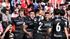 Real Sociedad's Spanish forward Ander Barrenetxea (2nd-L) celebrates with teammates after scoring his team's second goal during the Spanish league football match between Rayo Vallecano de Madrid and Real Sociedad at the Vallecas stadium in Madrid on January 21, 2023. (Photo by OSCAR DEL POZO / AFP)