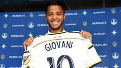 CARSON, CA - AUGUST 04:  Giovani Dos Santos #10 of the Los Angeles Galaxy holds up his new jersey at a press conference at StubHub Center on August 4, 2015 in Carson, California.  (Photo by Harry How/Getty Images)