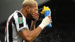 NEWCASTLE UPON TYNE, ENGLAND - JANUARY 10: Newcastle player Joelinton sprays his face with water prior to the Carabao Cup Quarter Final match between Newcastle United and Leicester City at St James' Park on January 10, 2023 in Newcastle upon Tyne, England. (Photo by Stu Forster/Getty Images)