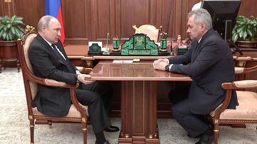 Russian President Vladimir Putin meets with Russian Defence Minister Sergei Shoigu.