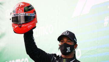 Lewis Hamilton presented with Schumacher's helmet after equalling 91 wins record