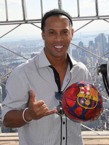 Ronaldinho poses on the observation deck after pulling the switch to light the Empire State Building in honor of FC Barcelona's 10-year global partnership with UNICEF in New York on September 7, 2016. FC Barcelona gets the ultimate New York welcome on Wed