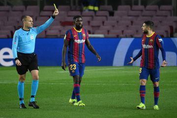 In action | Spanish referee Antonio Mateu Lahoz shows a yellow card to Barcelona's Spanish defender Jordi Alba.