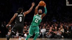 Nov 14, 2017; Brooklyn, NY, USA; Boston Celtics point guard Kyrie Irving (11) passes the ball away from Brooklyn Nets small forward DeMarre Carroll (9) during the fourth quarter at Barclays Center. Mandatory Credit: Brad Penner-USA TODAY Sports     TPX IM