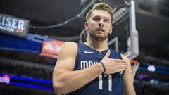 Dallas Mavericks guard Luka Doncic (77) reacts to making a basket against the New York Knicks during the second quarter at the American Airlines Center. Mandatory Credit: Jerome Miron-USA TODAY Sports