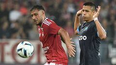Brest's Algerian forward Youcef Belaili (L) fights for the ball with Marseille's Chilean forward Alexis Sanchez during the French L1 football match between Stade Brestois 29 (Brest) and Olympique de Marseille (OM) at Stade Francis-Le Ble in Brest, western France on August 14, 2022. (Photo by FRED TANNEAU / AFP) (Photo by FRED TANNEAU/AFP via Getty Images)