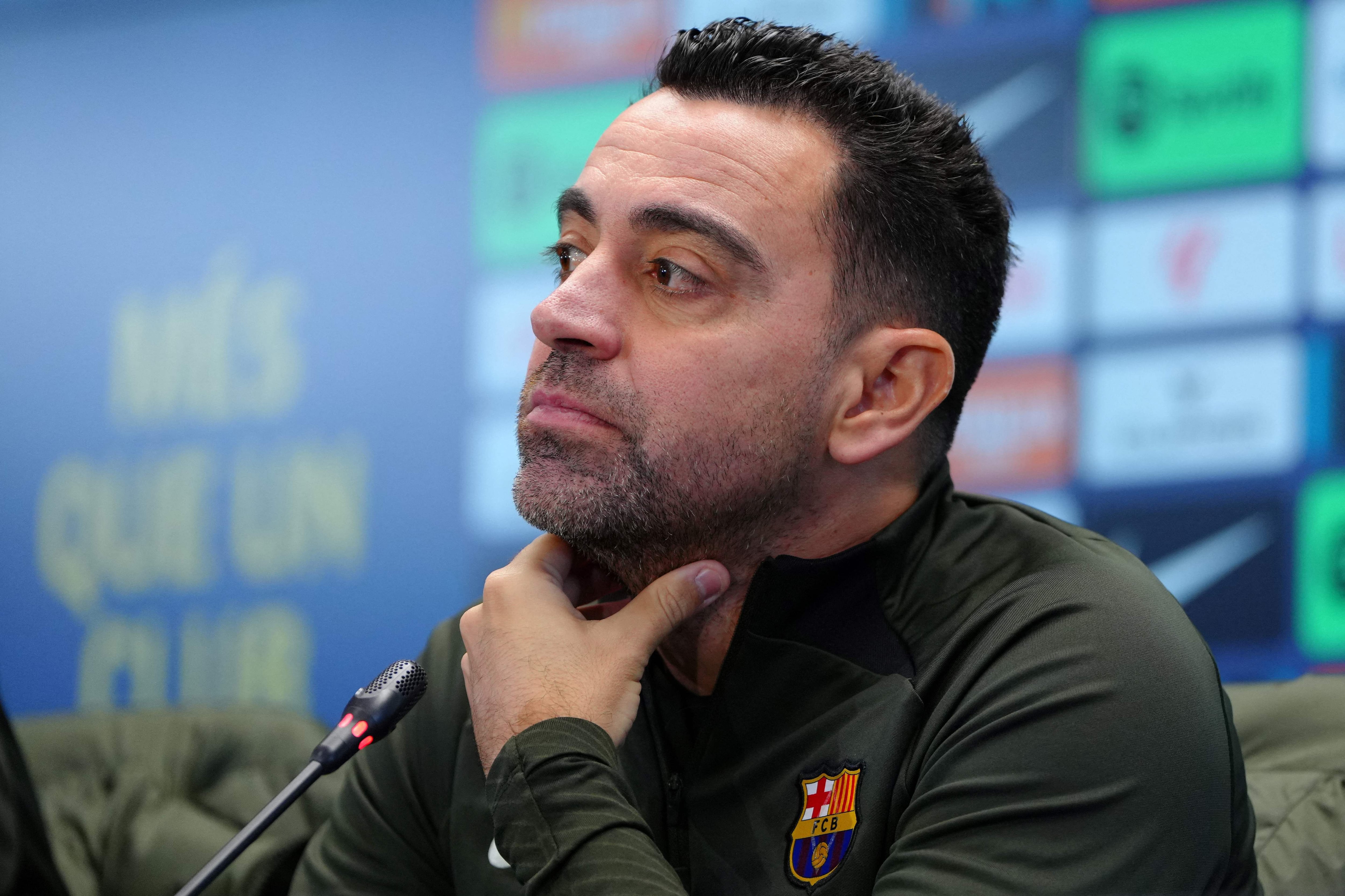 Barcelona's Spanish coach Xavi addresses a press conference at the Joan Gamper training ground in Sant Joan Despi, near Barcelona, on January 30, 2024. Only a few months after lifting the Spanish title, Barcelona coach Xavi Hernandez dramatically announced he would walk away from the club at the end of the season. After Villarreal stunned Barcelona on January 28 with a 5-3 win which left the champions third, and 10 points behind La Liga leaders Real Madrid, Xavi said he was stepping down in June. (Photo by PAU BARRENA / AFP)