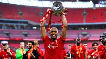 Liverpool's Fabinho celebrates with the trophy after winning the Emirates FA Cup final at Wembley Stadium, London. Picture date: Saturday May 14, 2022. (Photo by Adam Davy/PA Images via Getty Images)