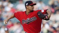 FILE - In this May 25, 2019, file photo, Cleveland Indians starting pitcher Carlos Carrasco delivers against the Tampa Bay Rays during the first inning of a baseball game in Cleveland. Indians right-hander Carrasco has returned to the mound in the minor leagues as he tries to come back after being diagnosed with leukemia. (AP Photo/Ron Schwane, File)
