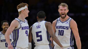 Nov 11, 2022; Los Angeles, California, USA;  Sacramento Kings guard Kevin Huerter (9), guard De'Aaron Fox (5) and forward Domantas Sabonis (10) celebrate after a basket in the fourth quarter against the Los Angeles Lakers at Crypto.com Arena. Mandatory Credit: Jayne Kamin-Oncea-USA TODAY Sports