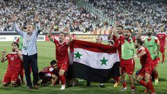 Syria&#039;s players celebrate at the end of their FIFA World Cup 2018 qualification football match against Iran at the Azadi Stadium in Tehran on September 5, 2017.