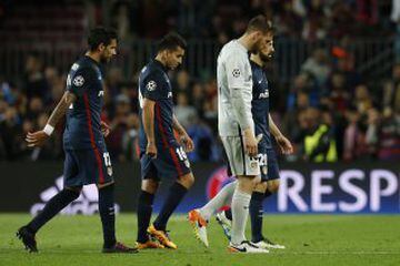 Atletico Madrid's Jan Oblak, Angel Correa and Augusto Fernandez walk off dejected after the game.