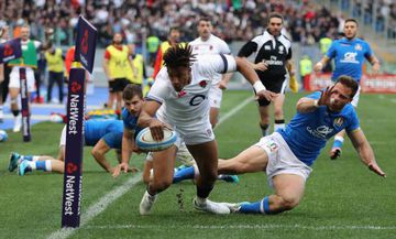 Anthony Watson of England dives over for his second try during the NatWest Six Nations match between Italy and England in Rome.