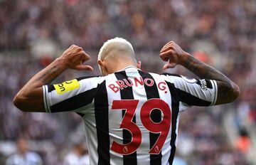 NEWCASTLE UPON TYNE, ENGLAND - OCTOBER 08: Newcastle player Bruno Guimaraes celebrates his second goal by pointing to his name during the Premier League match between Newcastle United and Brentford FC at St. James Park on October 08, 2022 in Newcastle upon Tyne, England. (Photo by Stu Forster/Getty Images)
