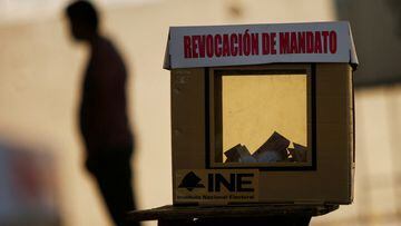 A shadow of a person casts behind a ballot box at a polling station during a referendum on whether President Andres Manuel Lopez Obrador should continue in office, in Ciudad Juarez, Mexico April 10, 2022. REUTERS/Jose Luis Gonzalez
